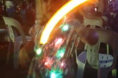 Jasmine Dancing with her candle and christmas light necklace and again